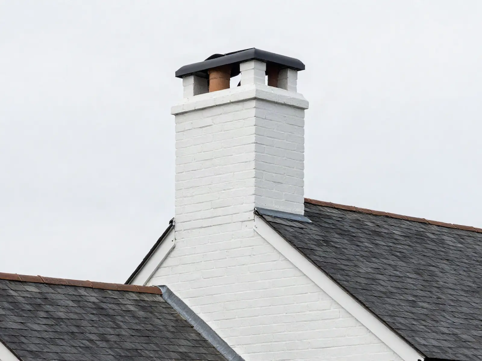 Brick chimney on a home served by MH & Sons Chimney Service in Chicago, IL